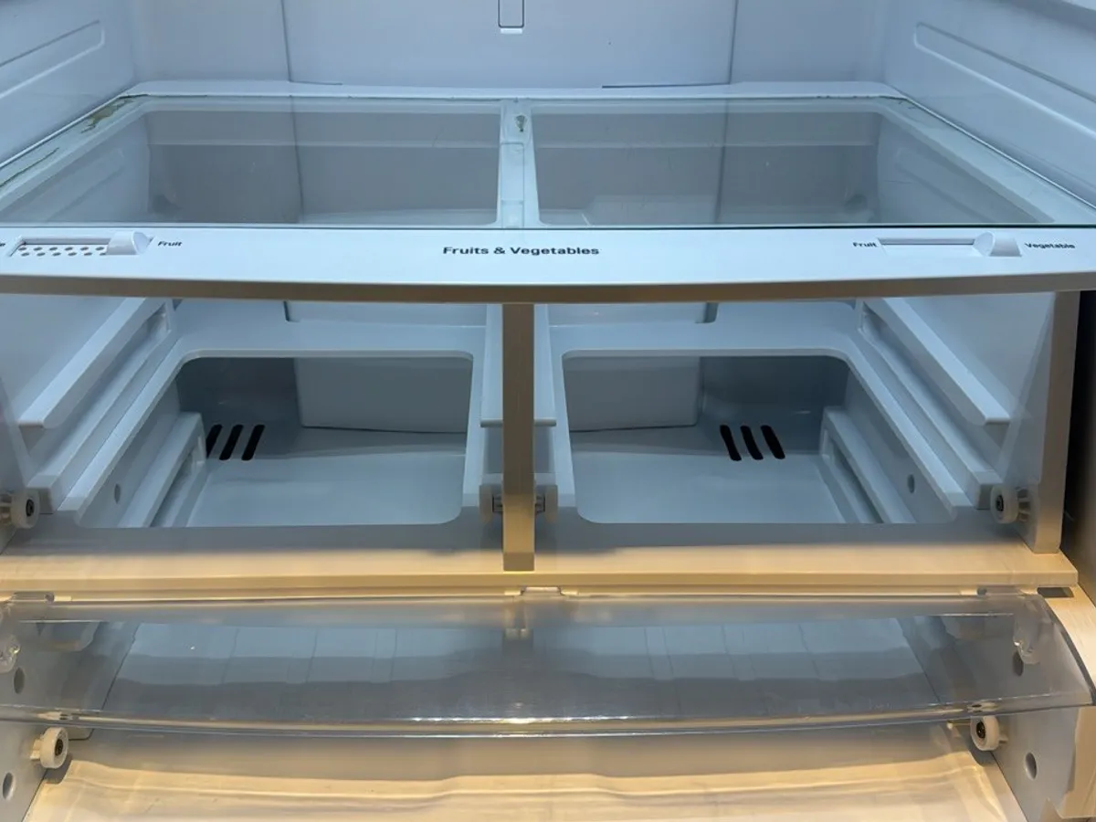 The same two drawers and the glass shelf above them, clean