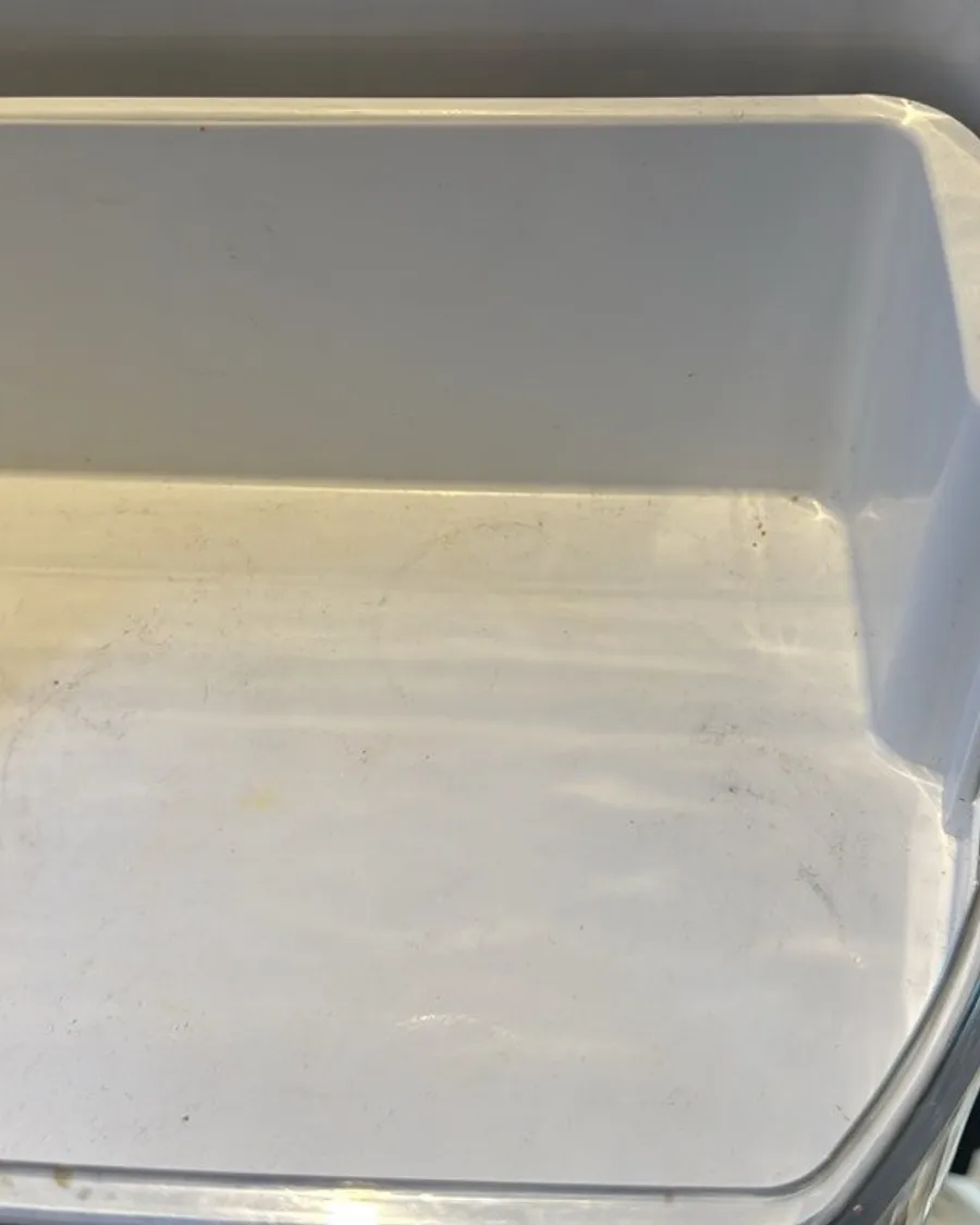 Clear fridge door bin, empty