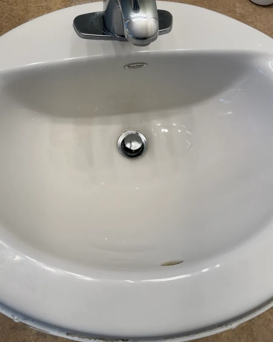 White bathroom sink with a chrome faucet